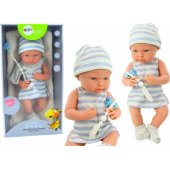 Baby doll in blue and white clothes, hat, pacifier, bib, quilt